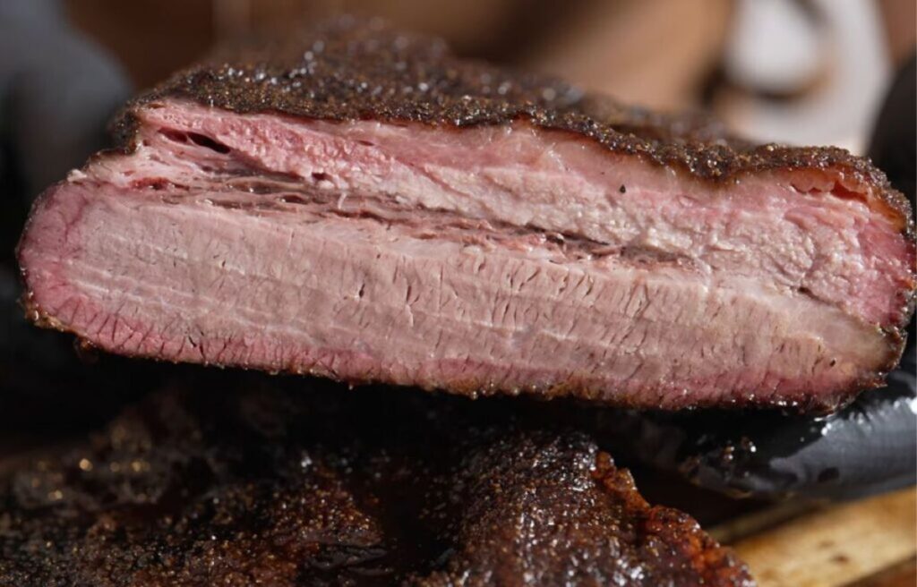 Smoked brisket with a smoke ring on a pellet grill