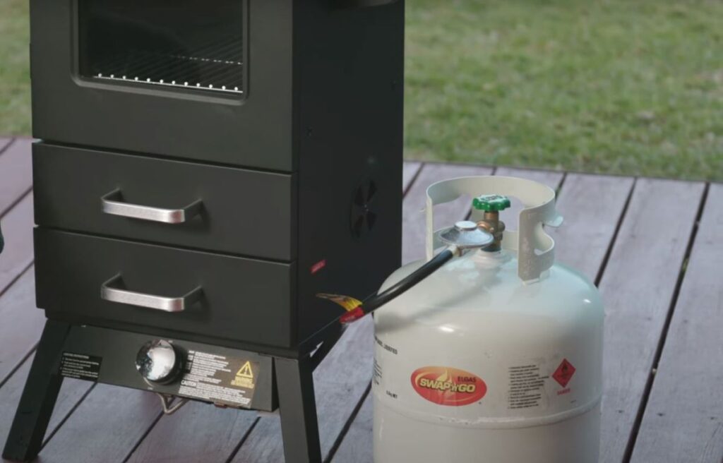 Using vertical smoker with gas as fuel source