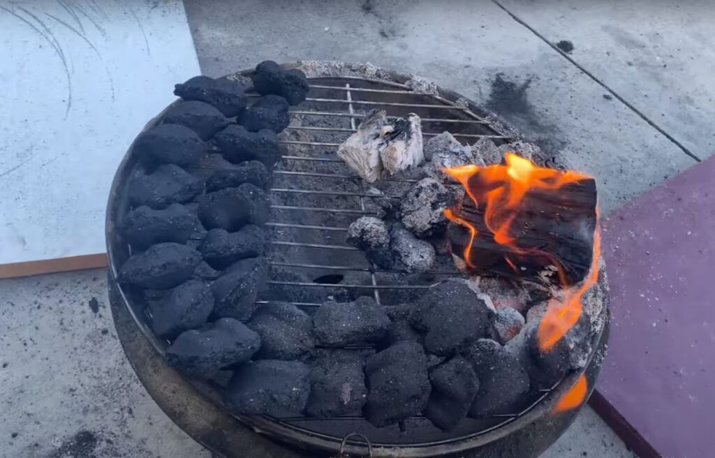 Burning Charcoal And Wood For Smoking Meat