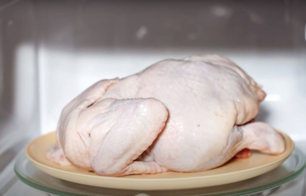 Defrosting a whole chicken inside microwave
