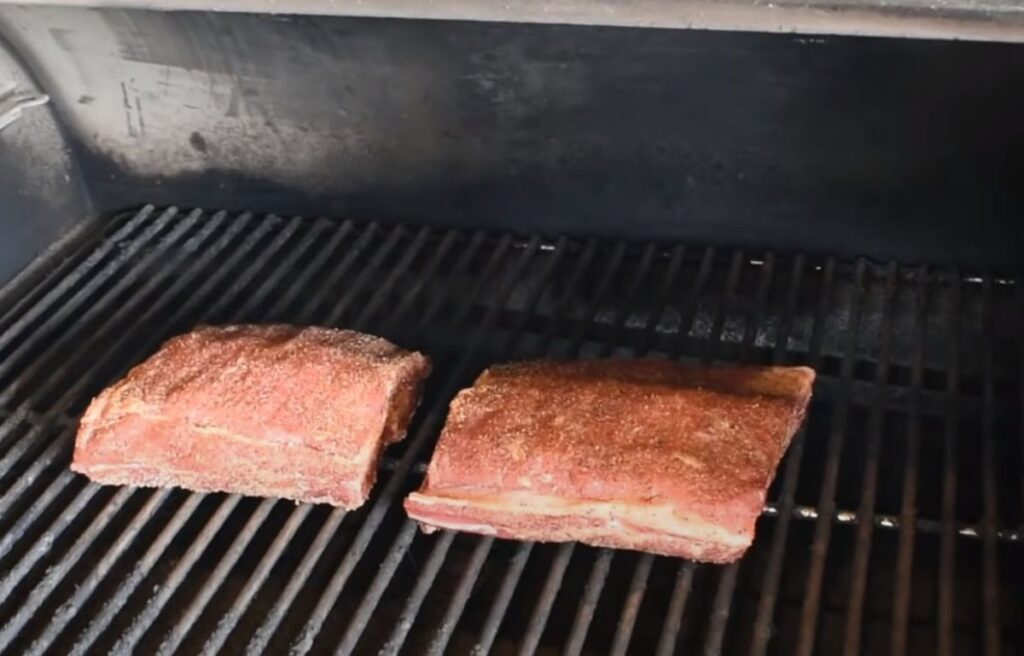 Placing the beef ribs inside smoker