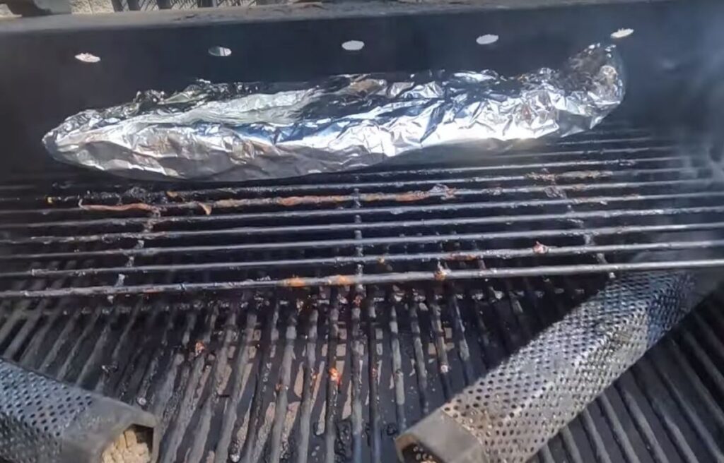 Smoking ribs wrapped for 2-2-1 method