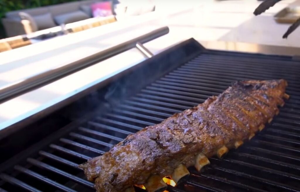 Do you flip ribs when grilling