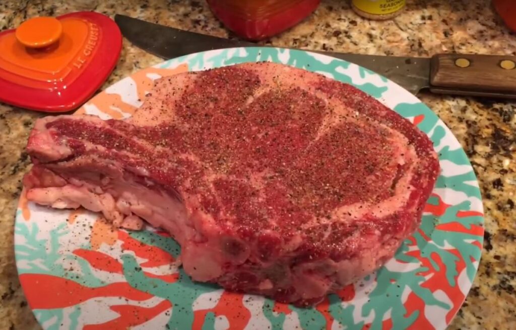 Seasoning a ribeye steak